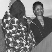 A woman testifying with a veil