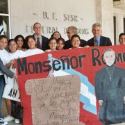 Group of citizens holding a poster